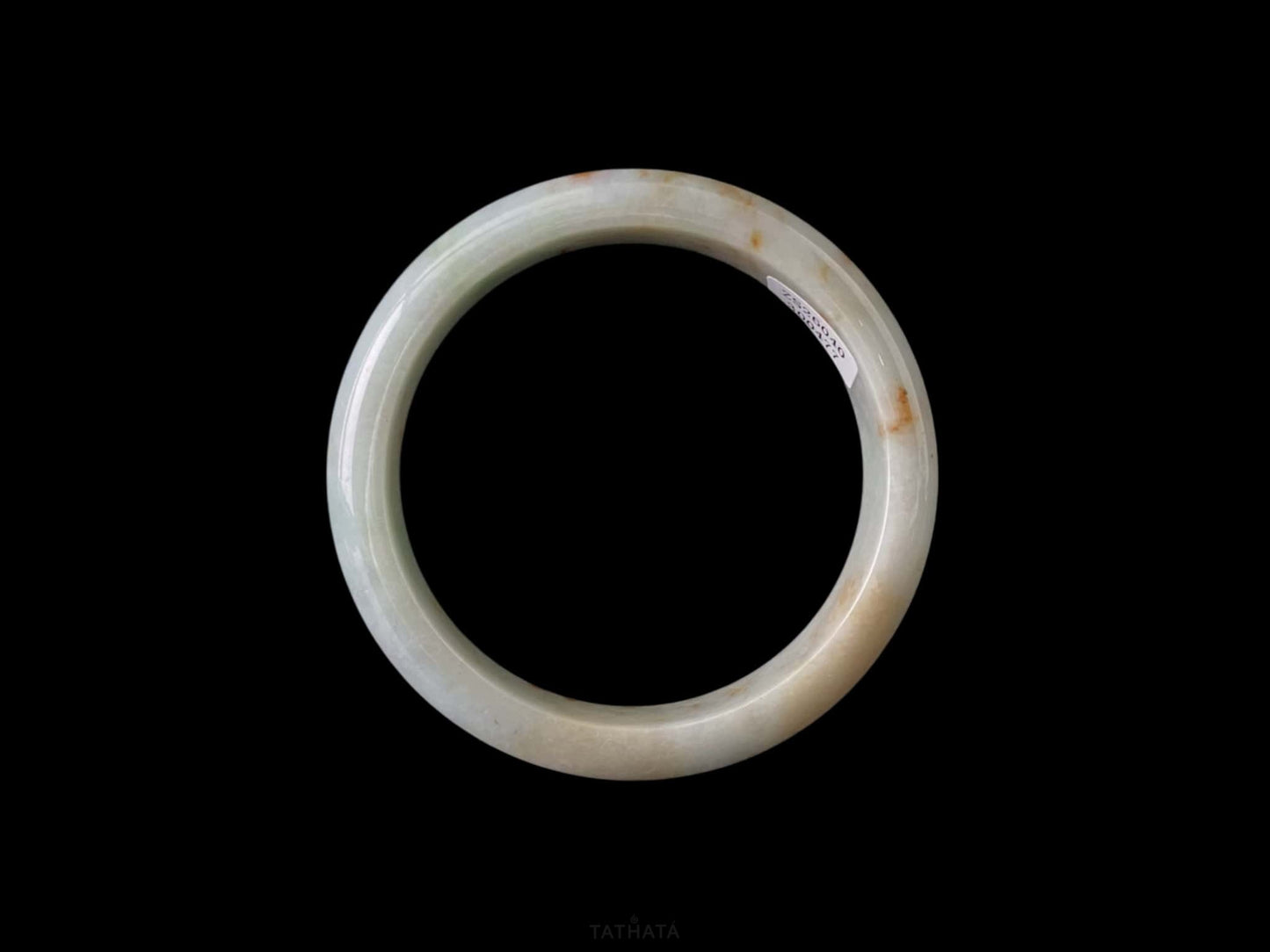 A ivory caramel fleck jadeite bangle.