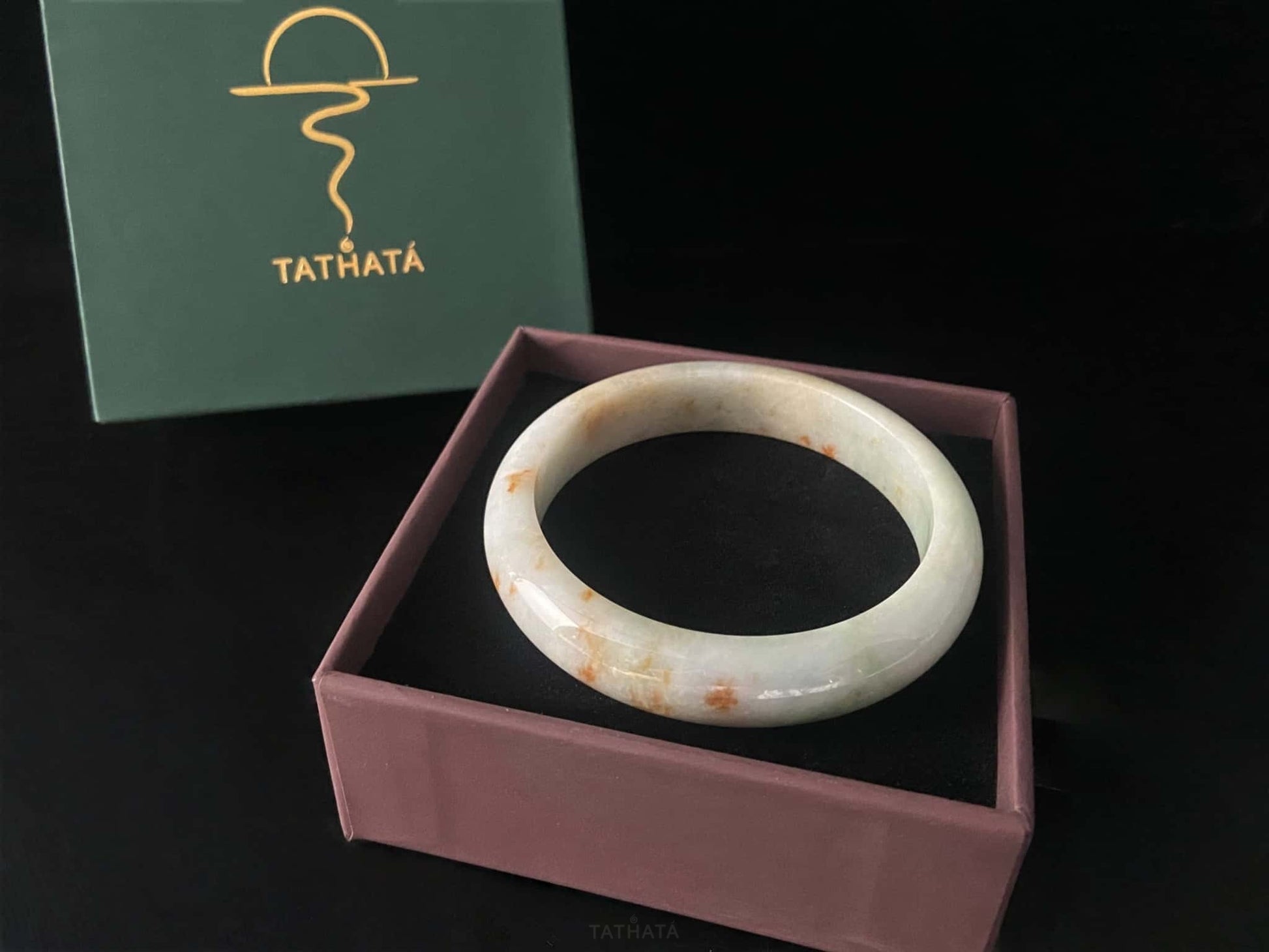A ivory caramel fleck jadeite bangle.
