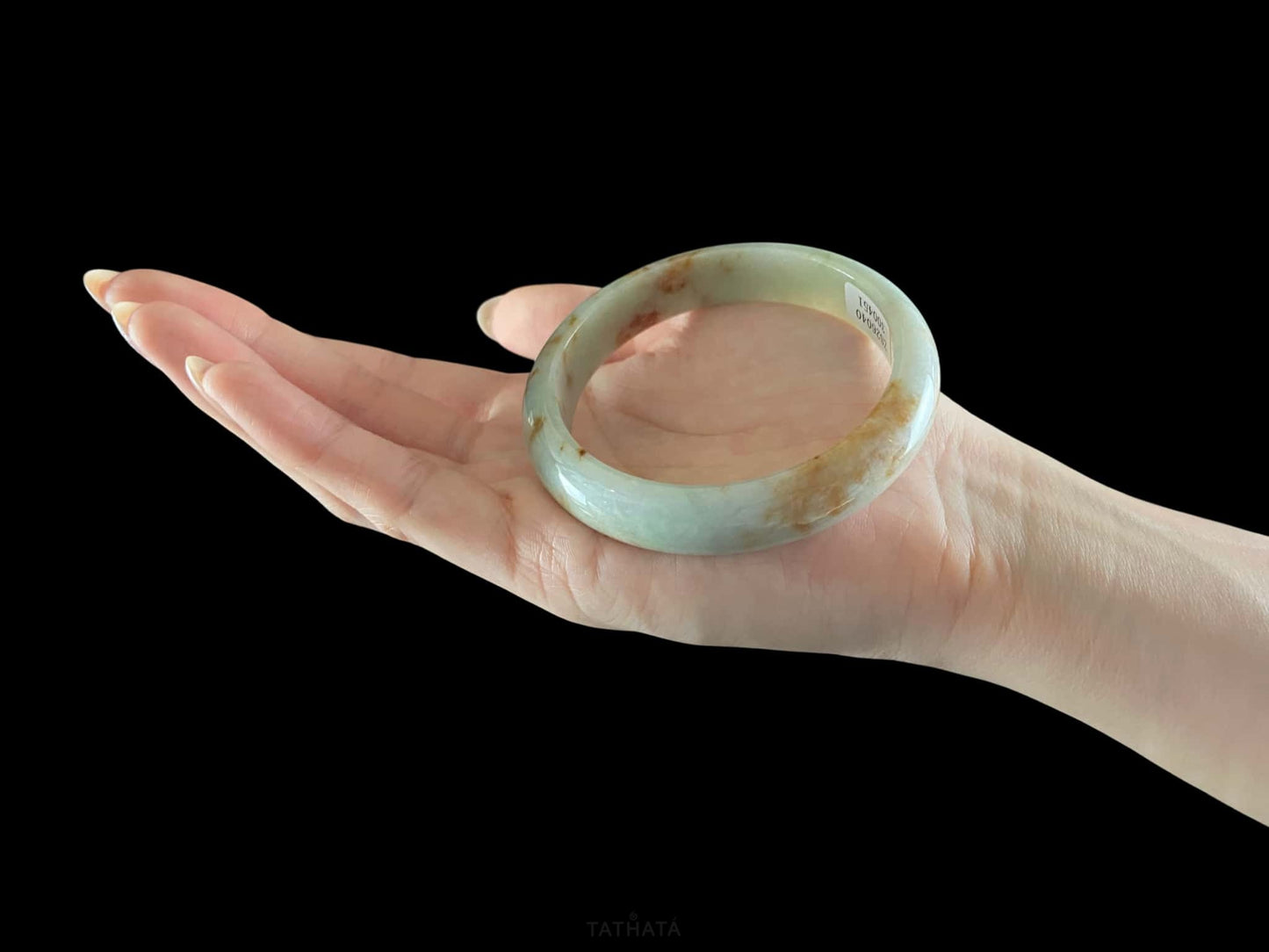 A moss coral calm jadeite bangle.