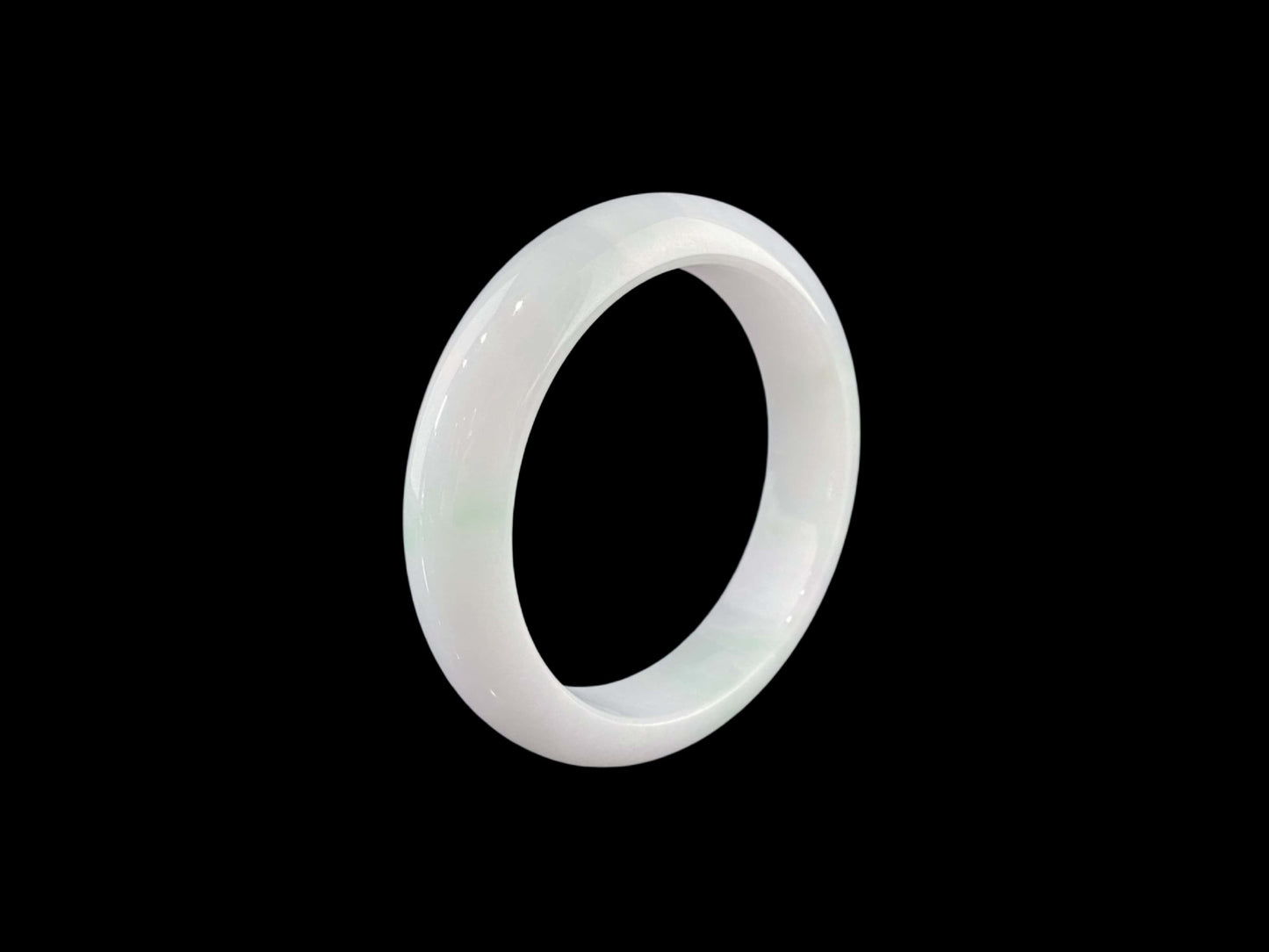 A pristine white with green veil jadeite bangle.