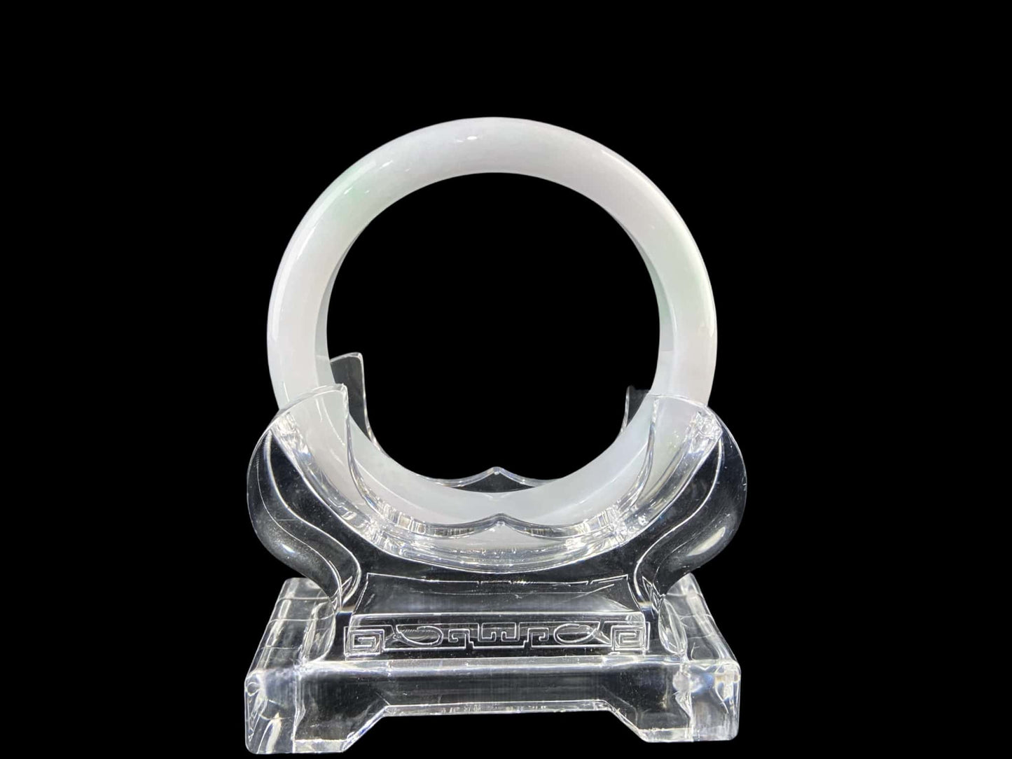 A pristine white with green veil jadeite bangle.