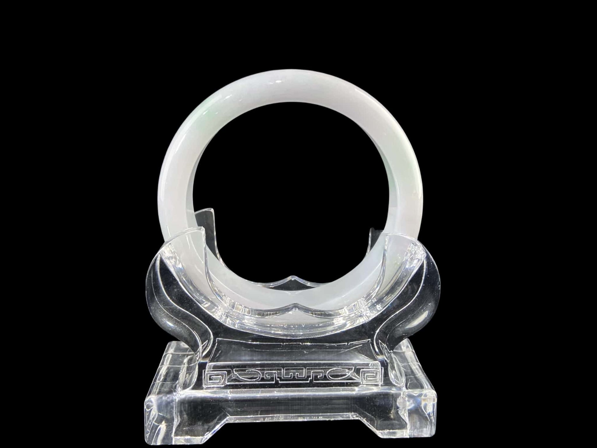 A pristine white with green veil jadeite bangle.