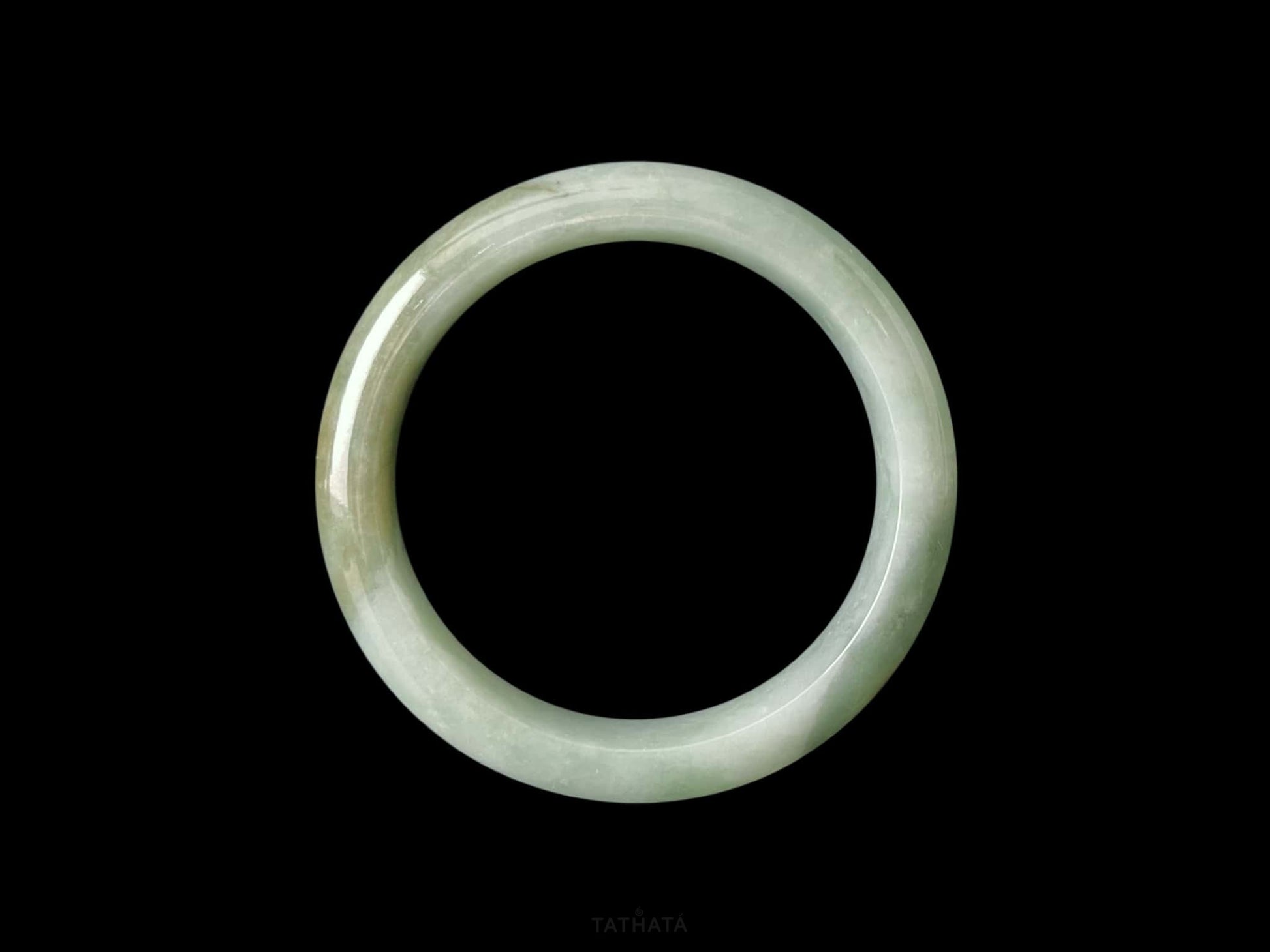 A frosted fern hue jadeite bangle.