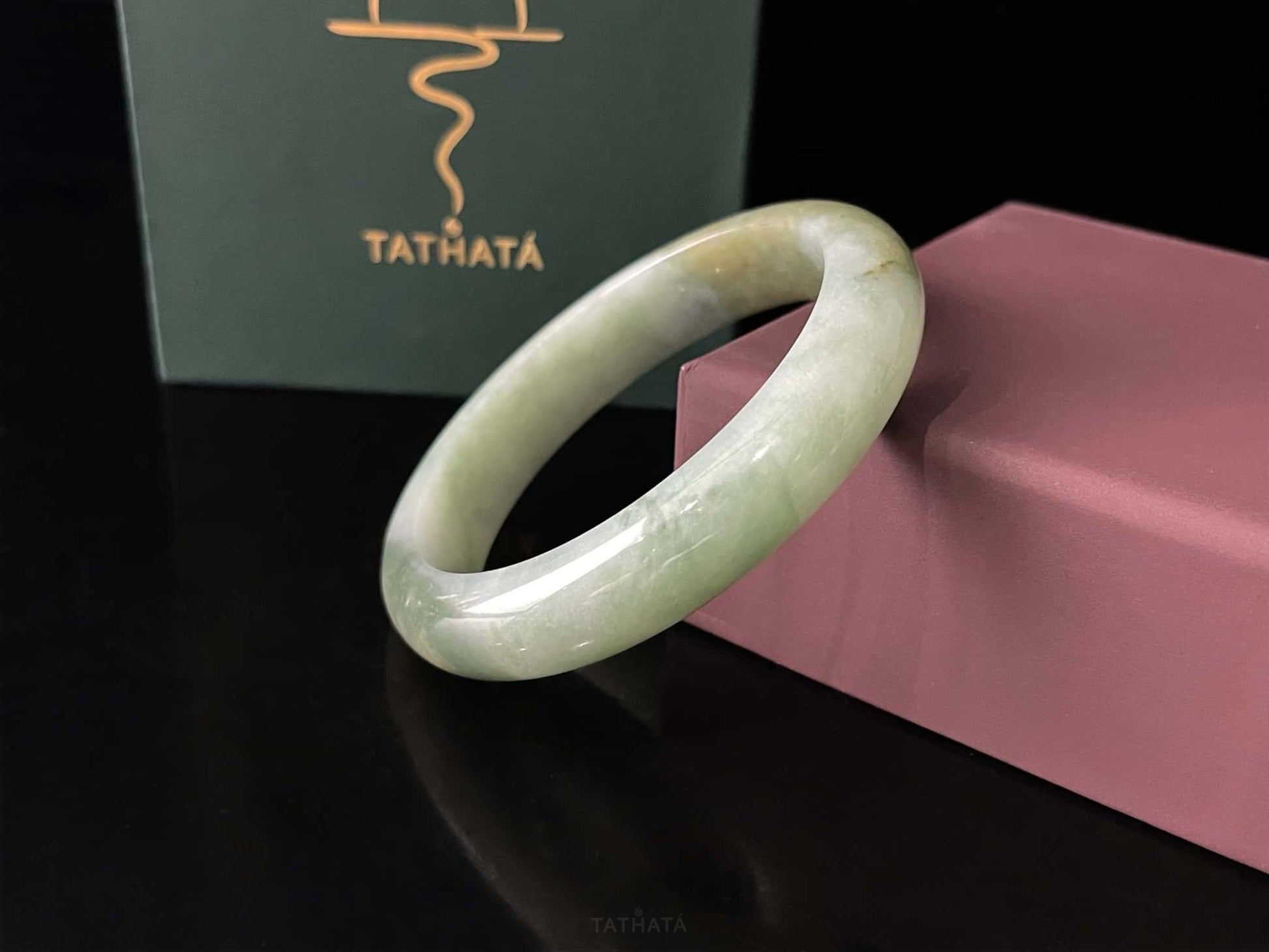 A frosted fern hue jadeite bangle.