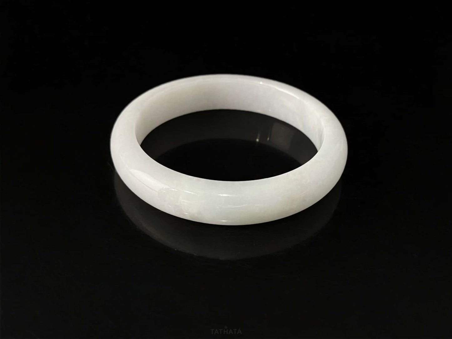 A cloudy milk white jadeite bangle.