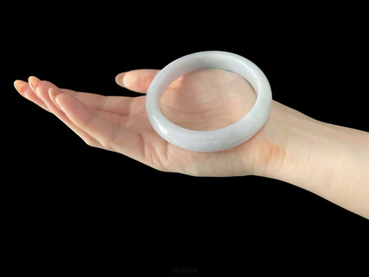 A cloudy milk white jadeite bangle.