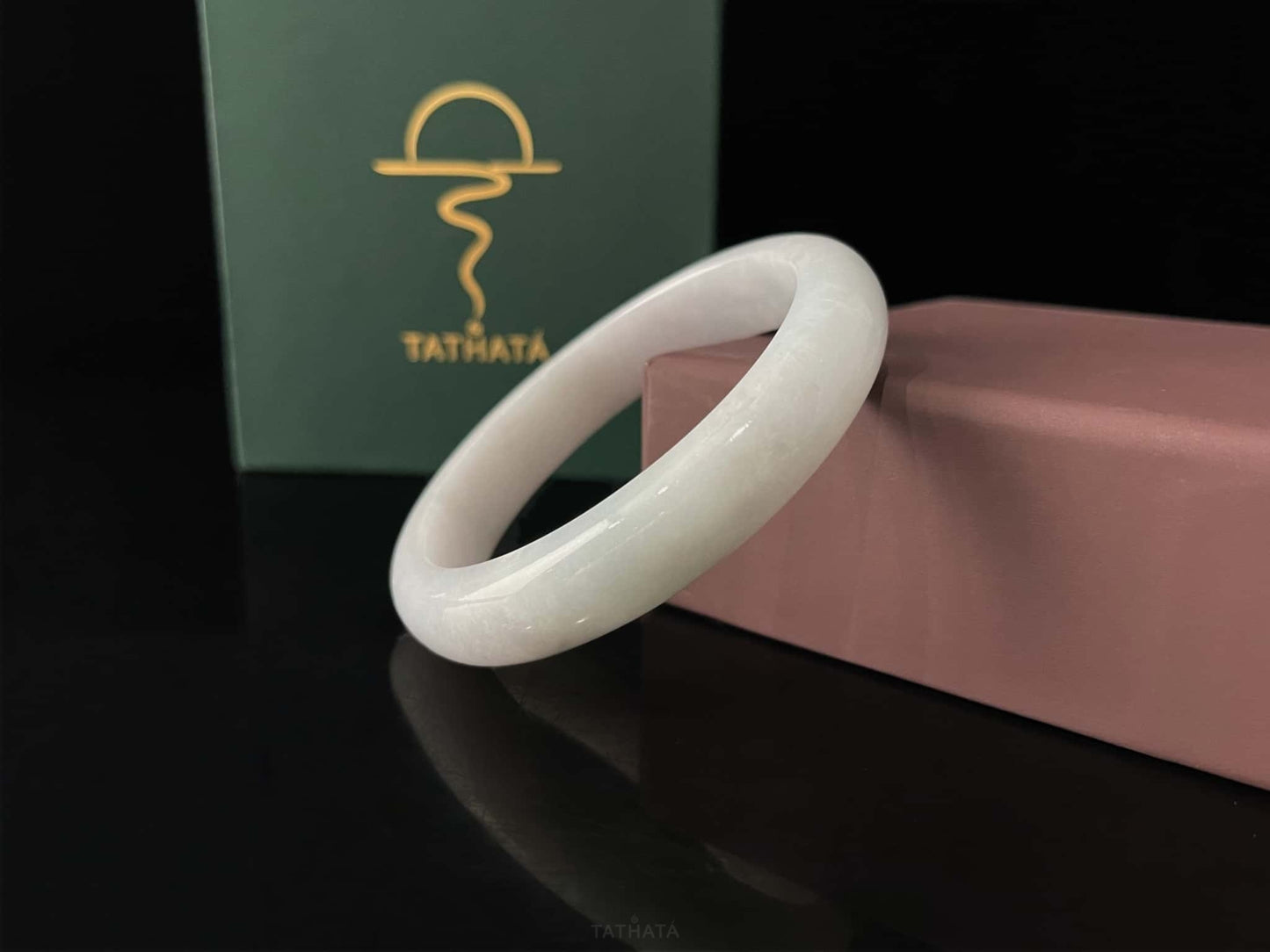 A cloudy milk white jadeite bangle.