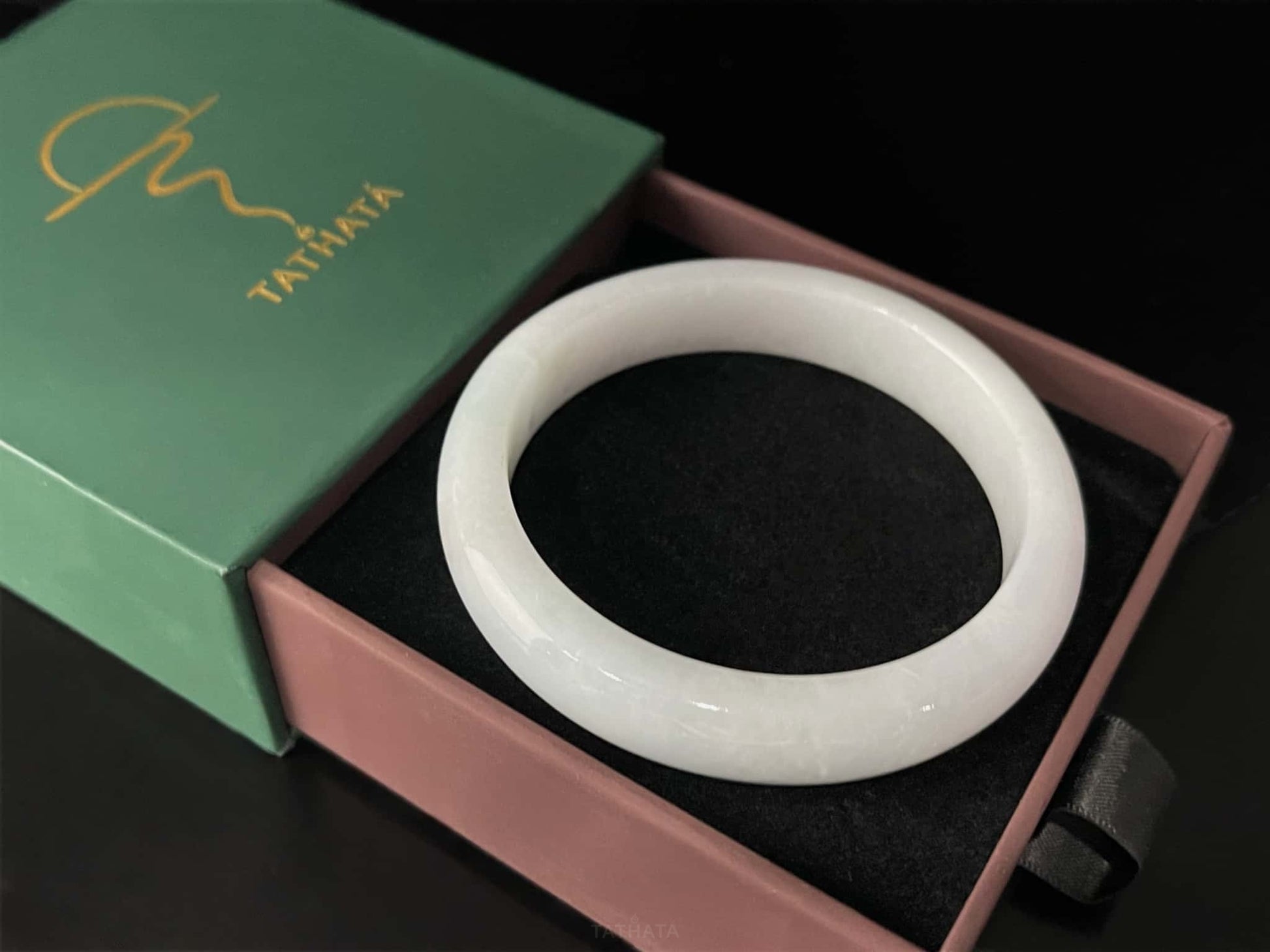 A cloudy milk white jadeite bangle.