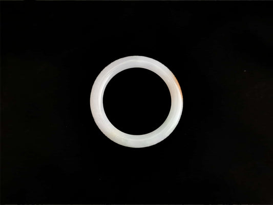 A pure white warm orange inlay jadeite bangle.