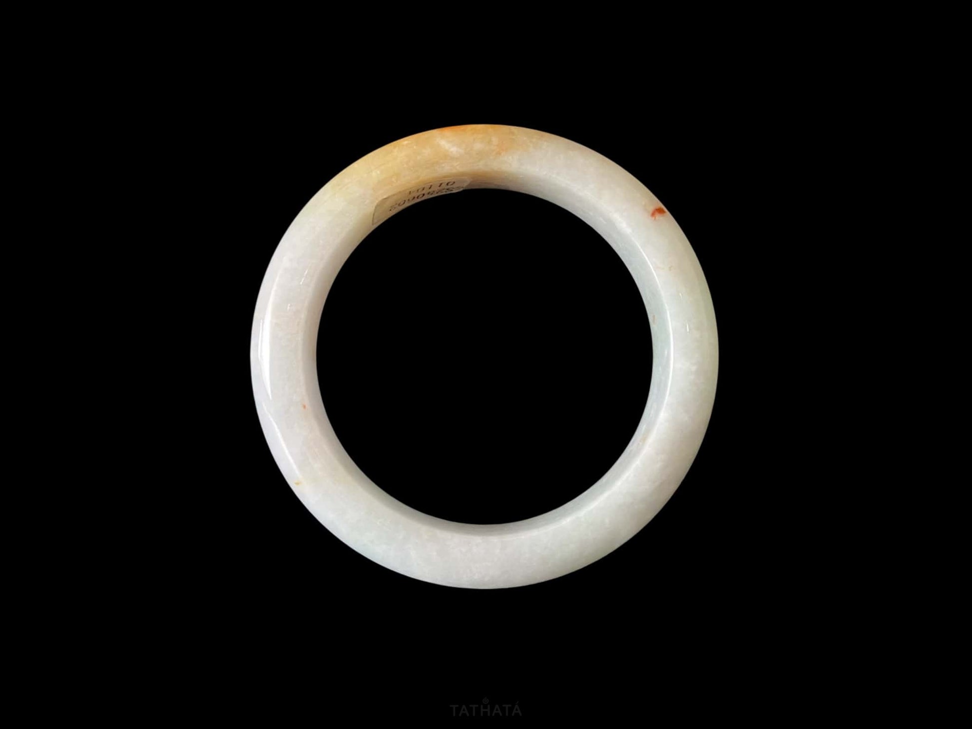 A creamy sunlit veil jadeite bangle.