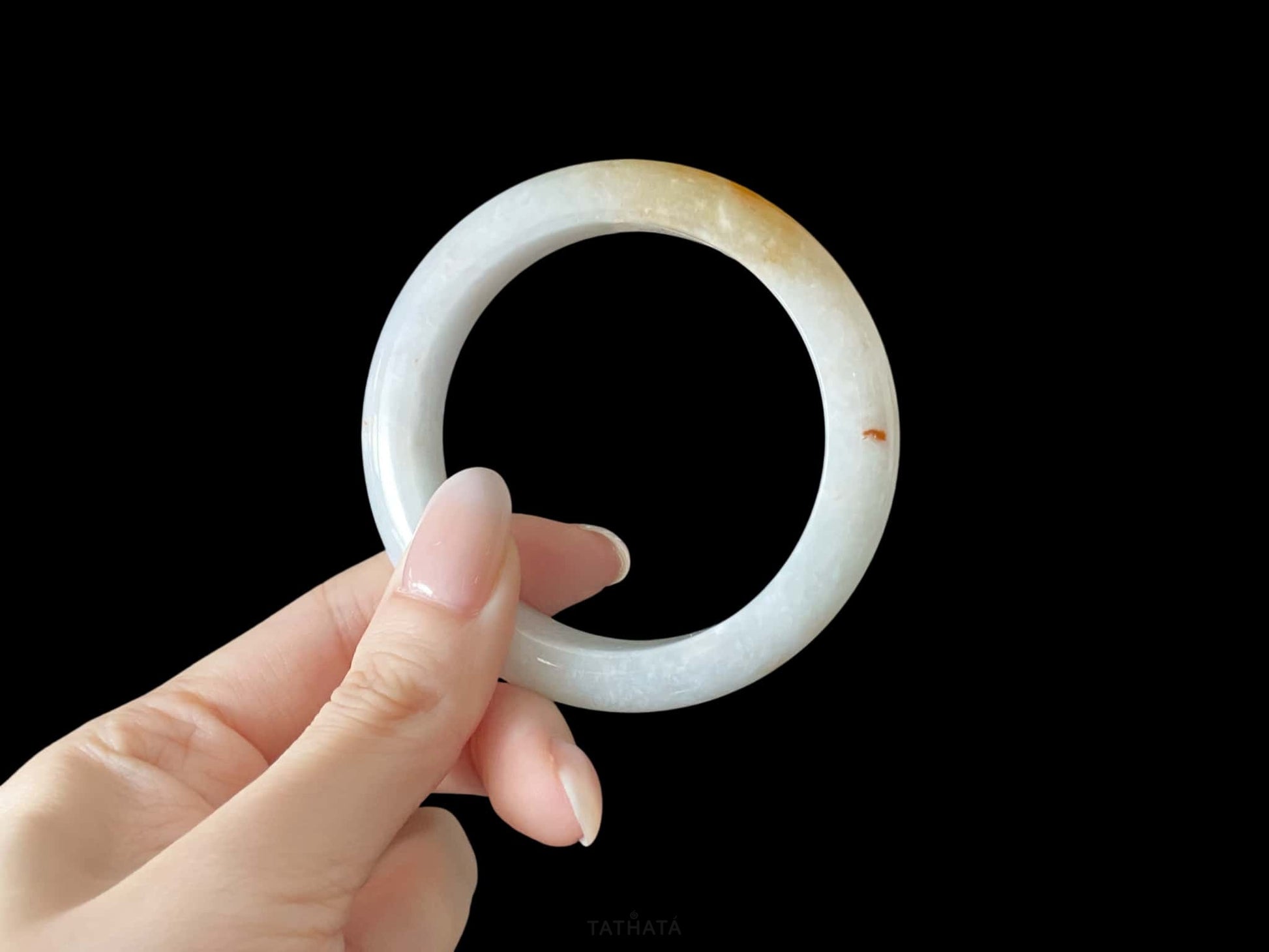 A creamy sunlit veil jadeite bangle.