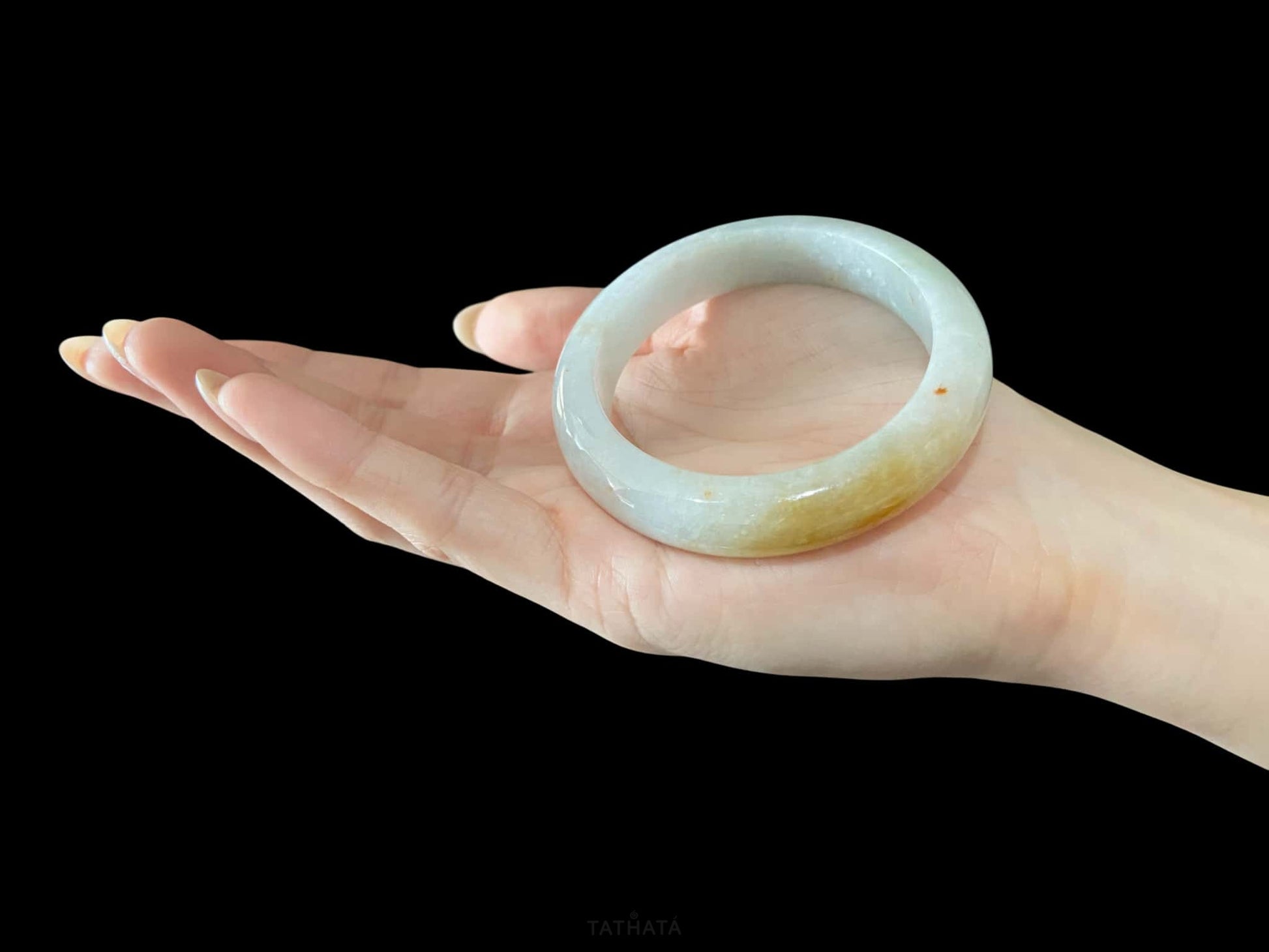 A creamy sunlit veil jadeite bangle.