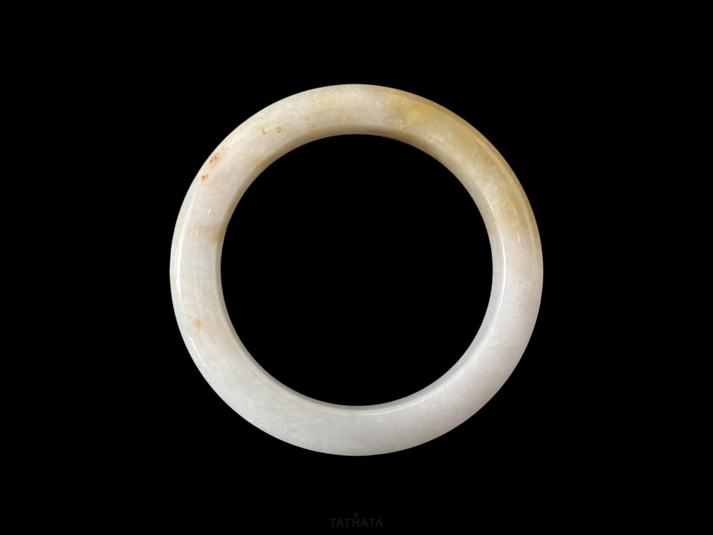 A golden honey veil jadeite bangle.
