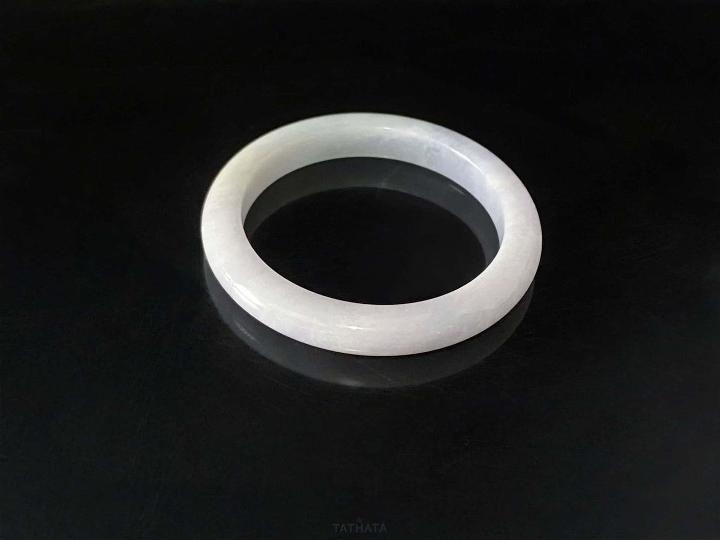 A coudy green mist jadeite bangle.