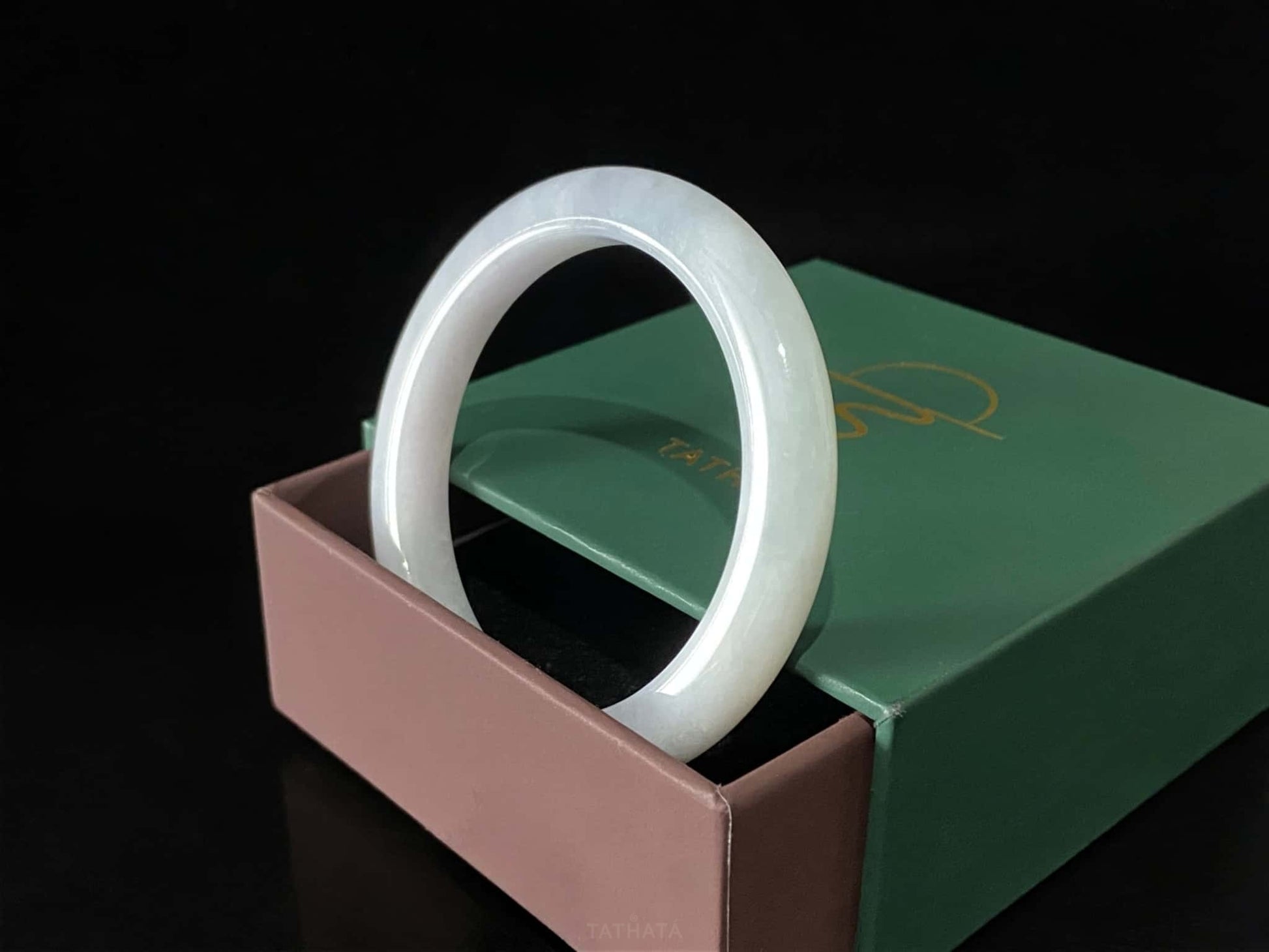 A coudy green mist jadeite bangle.