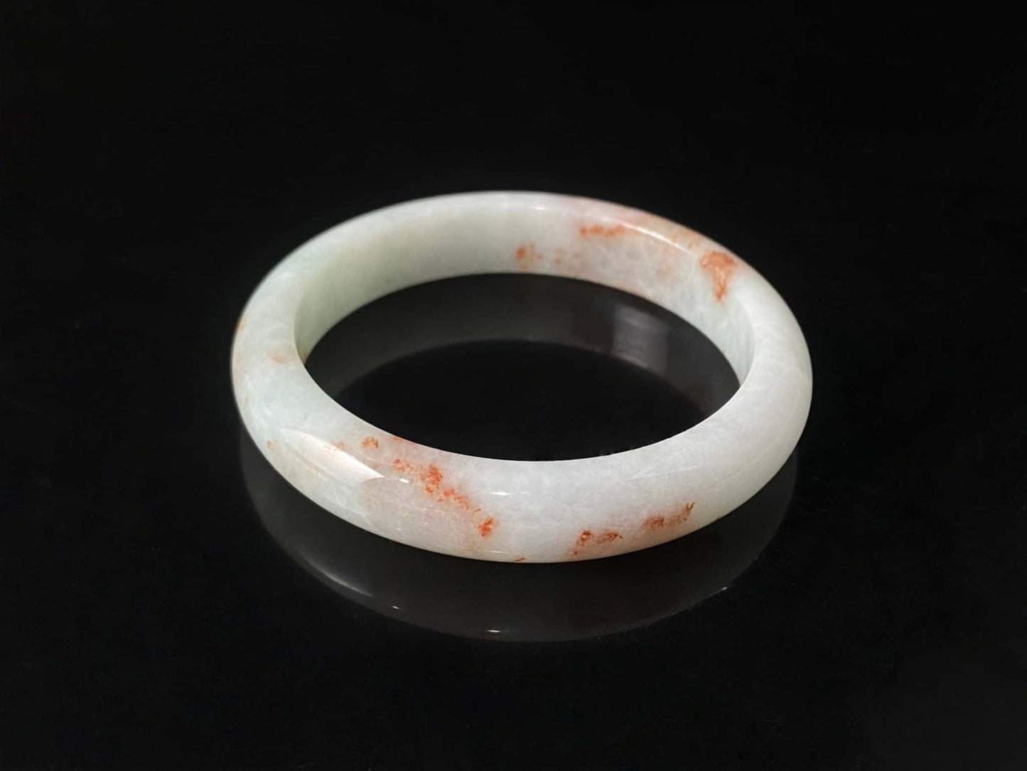 A pale spring green mist jadeite bangle.