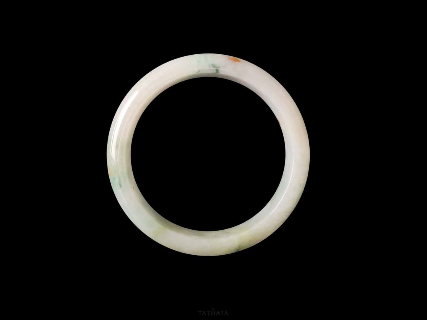 A milky mint honey spot jadeite bangle.