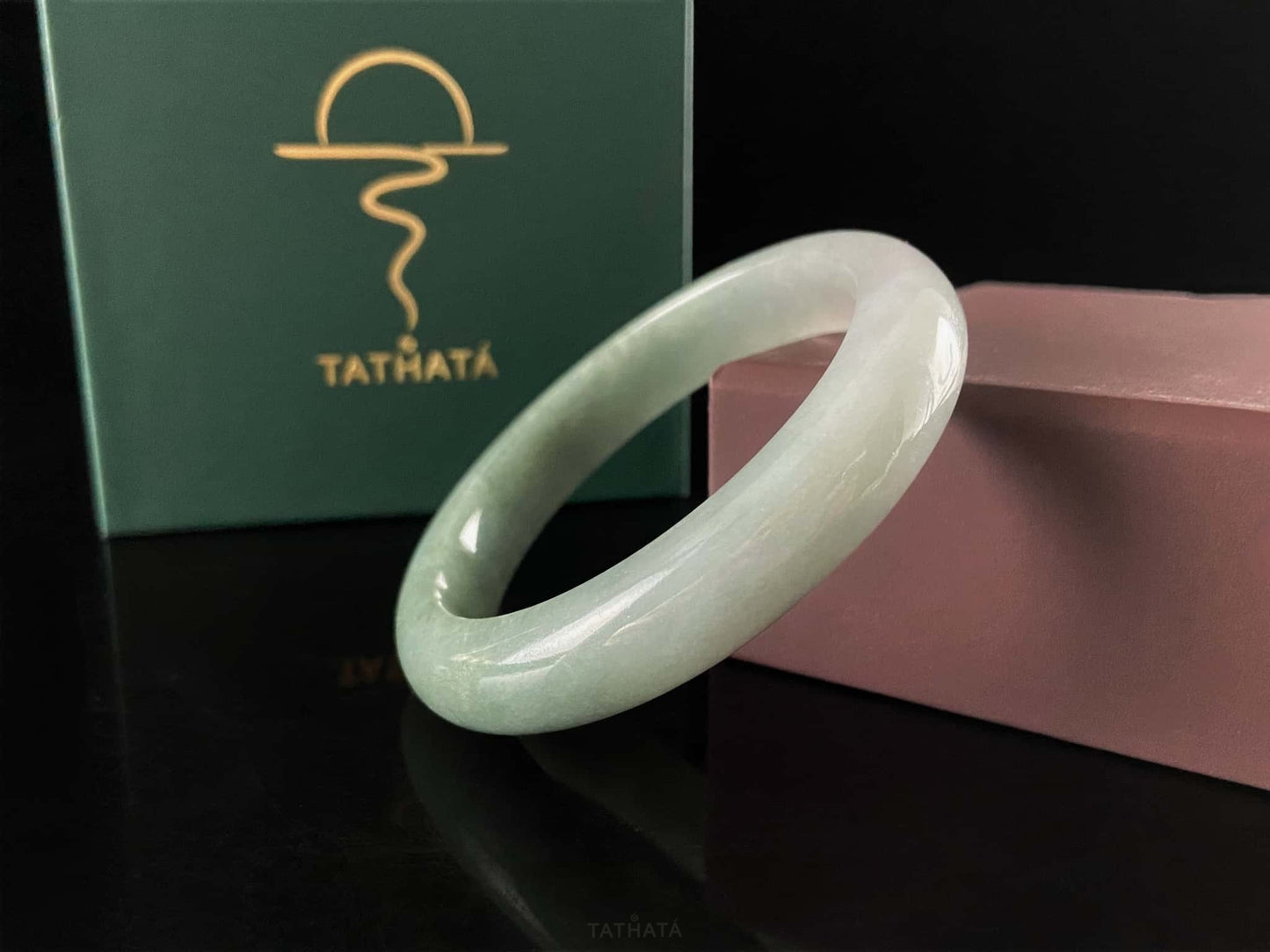 A willow green white veil jadeite bangle.