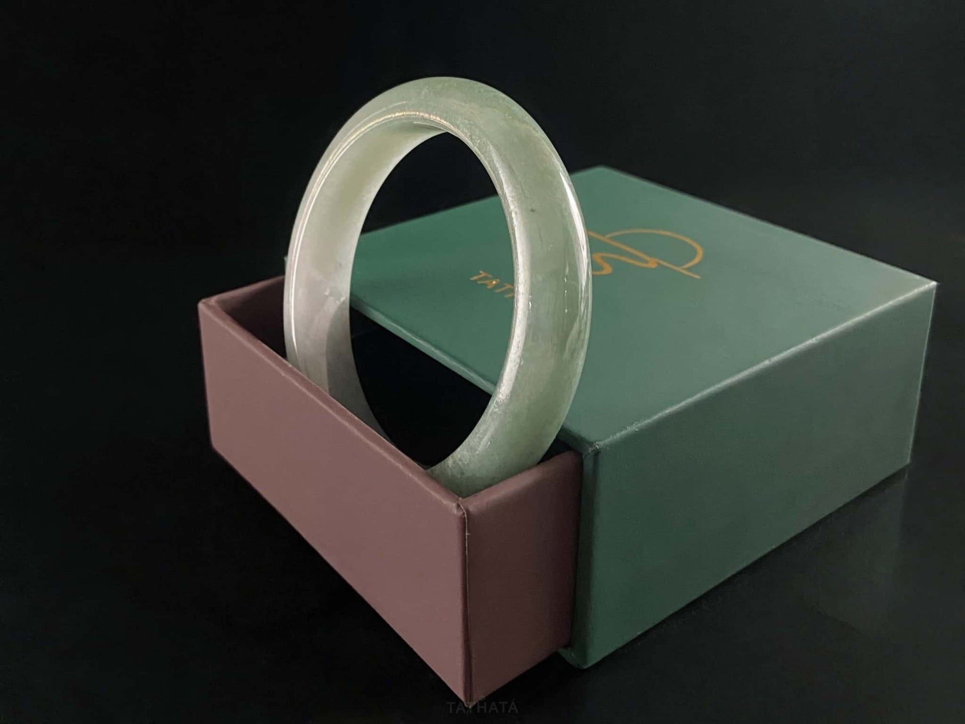 A willow green white veil jadeite bangle.