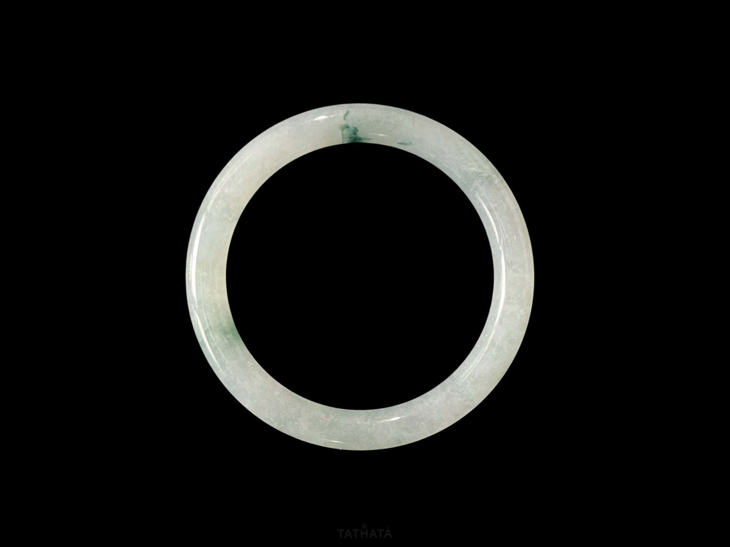A floating blue ink jadeite bangle.