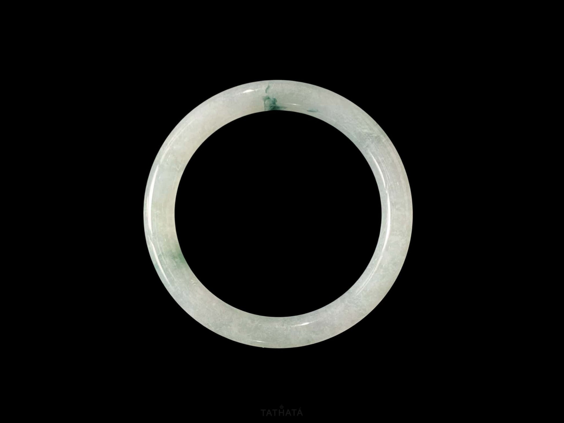 A floating blue ink jadeite bangle.