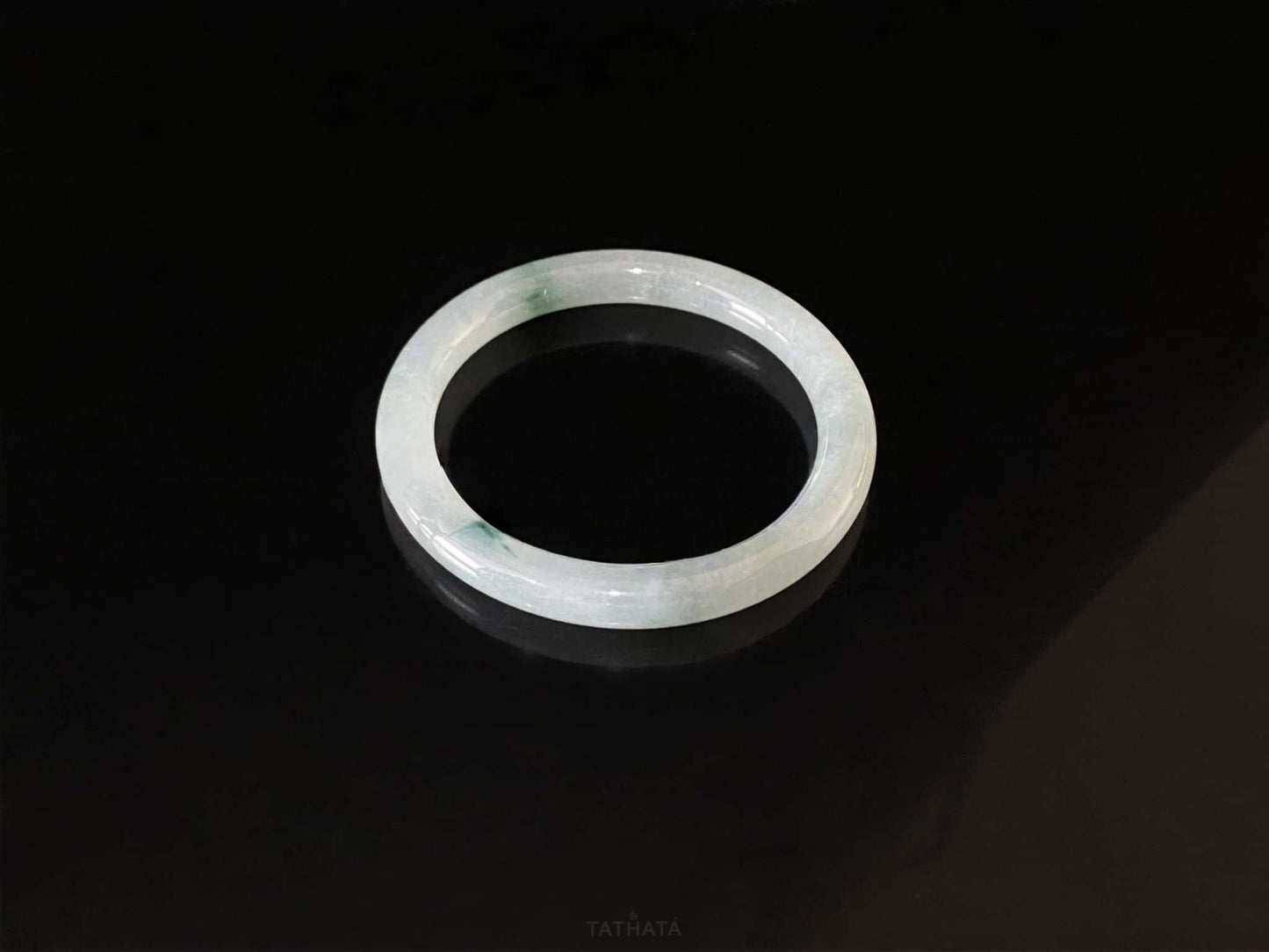 A floating blue ink jadeite bangle.