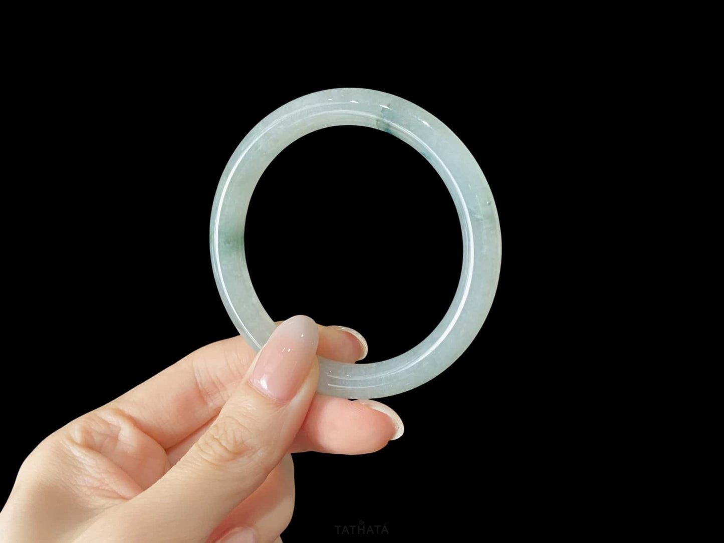 A floating blue ink jadeite bangle.