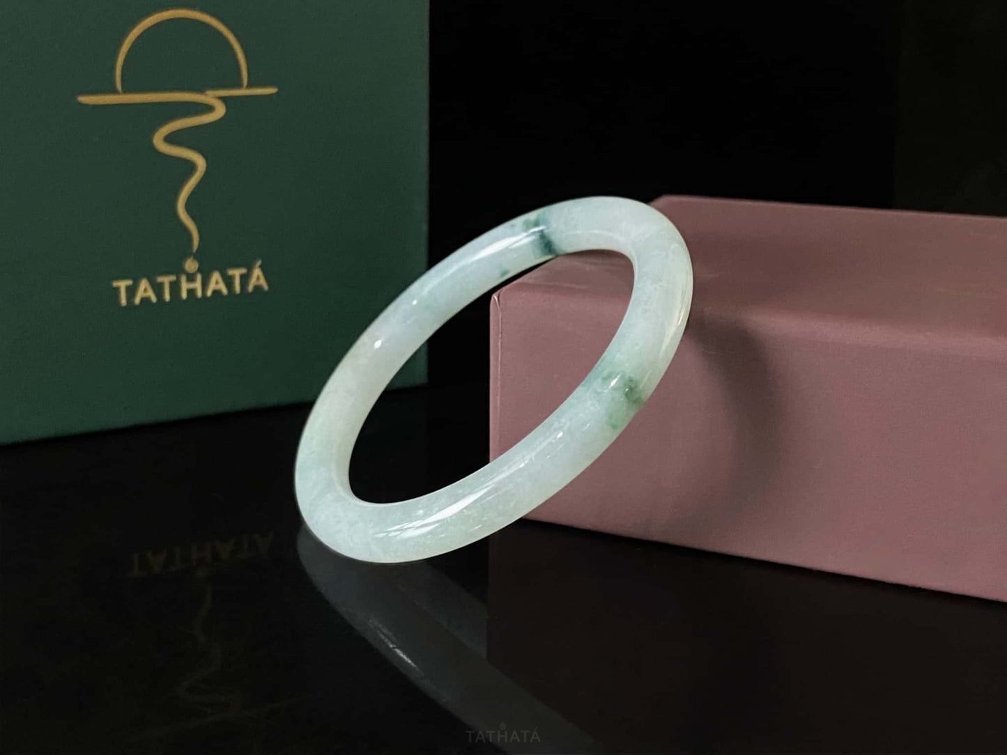 A floating blue ink jadeite bangle.