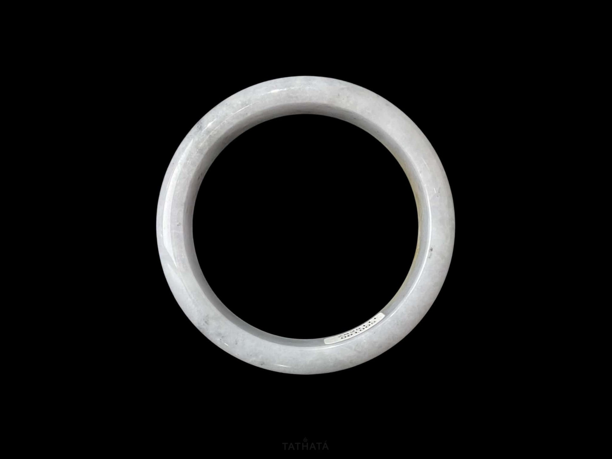 A honey amber halo jadeite bangle.