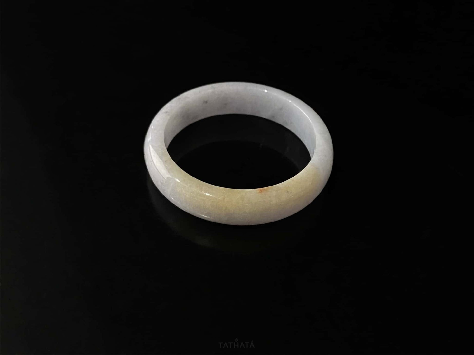 A honey amber halo jadeite bangle.