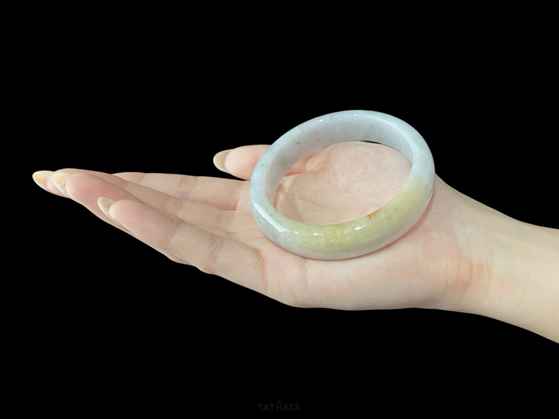A honey amber halo jadeite bangle.