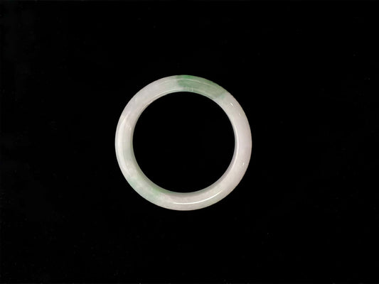 A cloud white and floating green jadeite bangle.