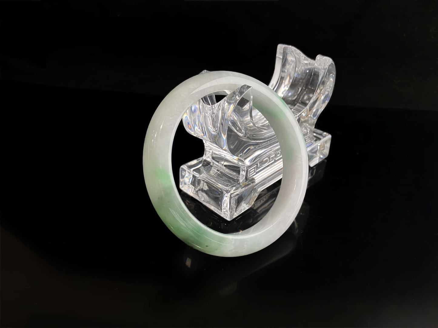A cloud white and floating green jadeite bangle.