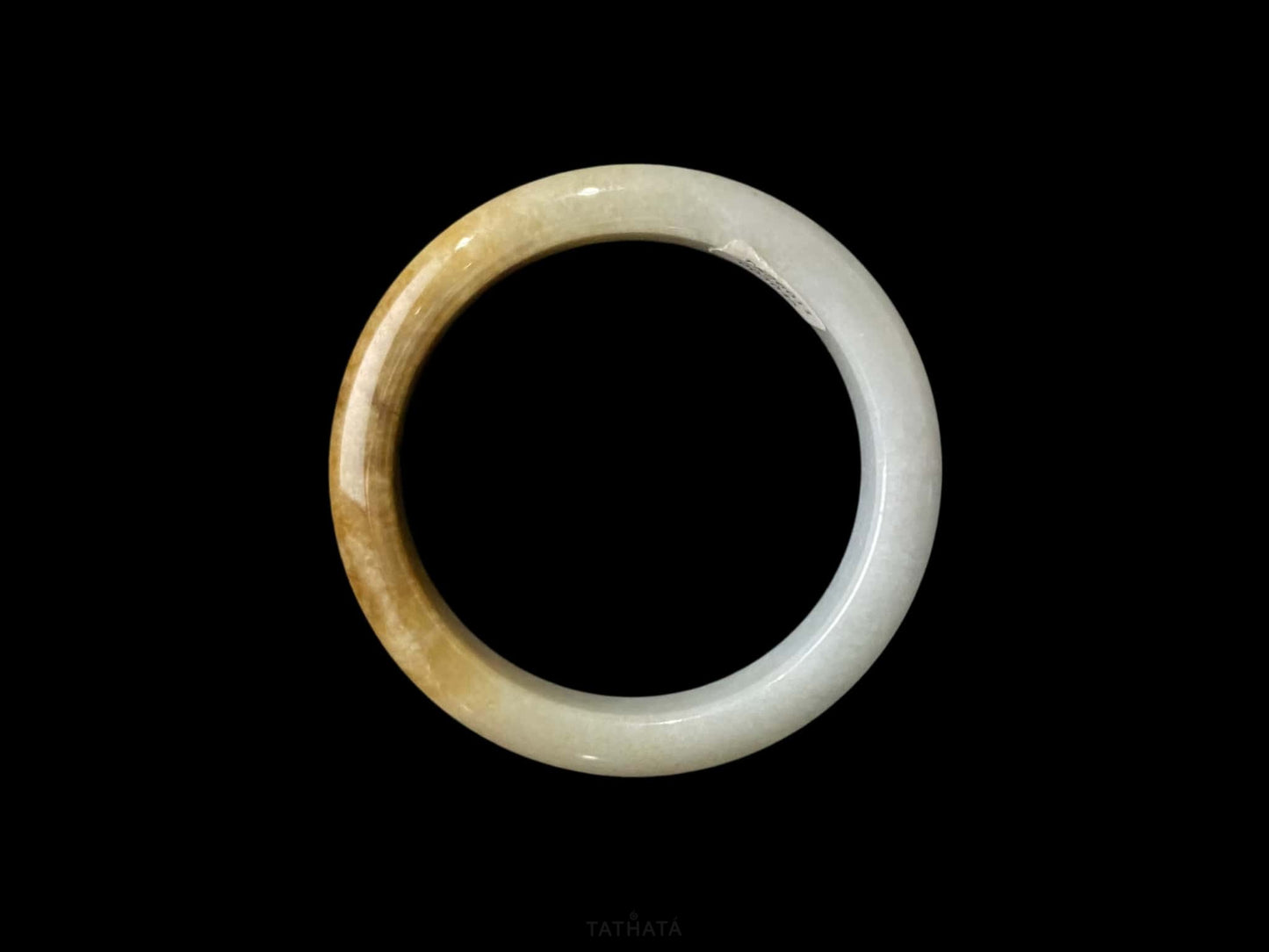 A sundrop amber glow jadeite bangle.