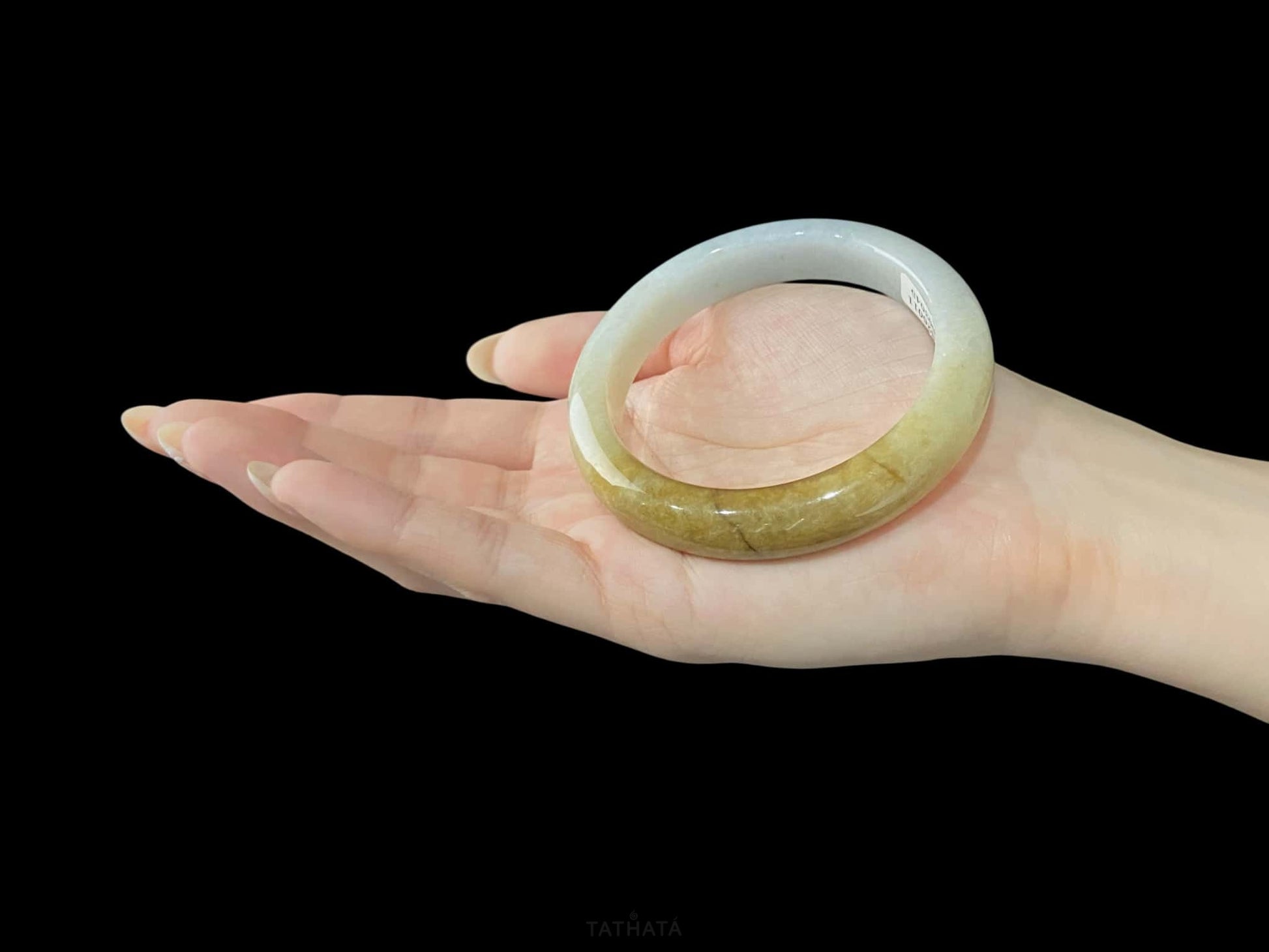 A sundrop amber glow jadeite bangle.