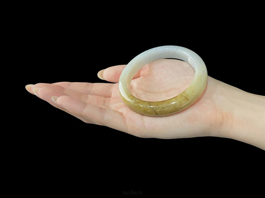 A sundrop amber glow jadeite bangle.