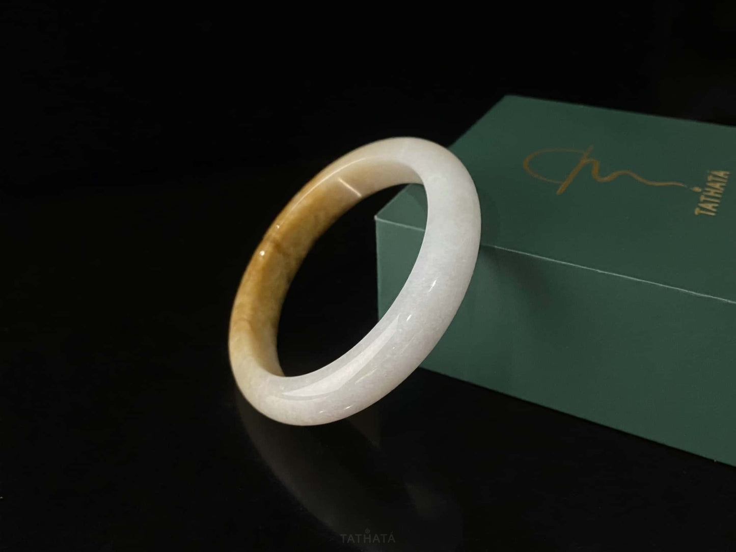 A sundrop amber glow jadeite bangle.