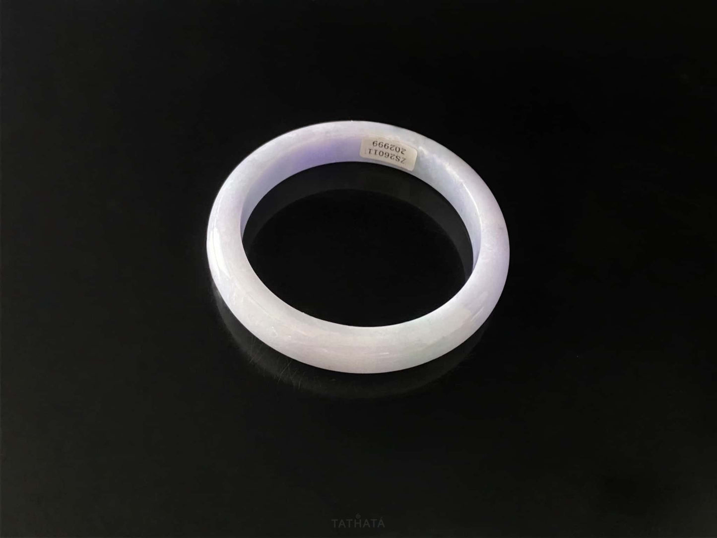 A lavender green streak jadeite bangle.