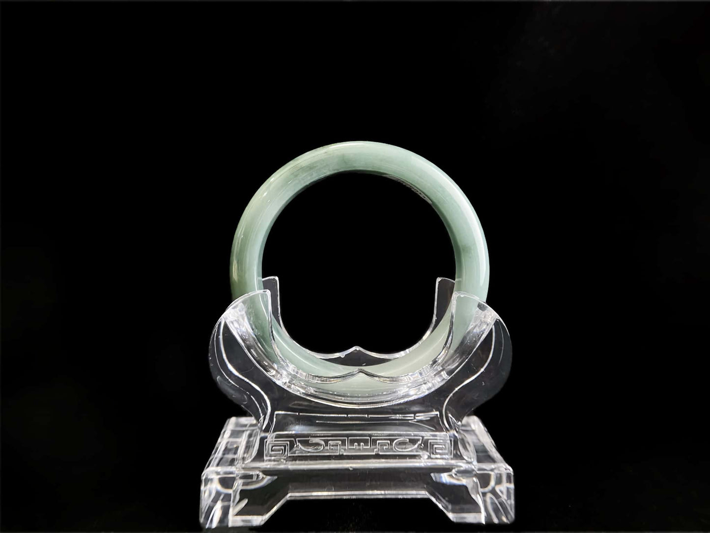 A white base mint green veil jadeite bangle.