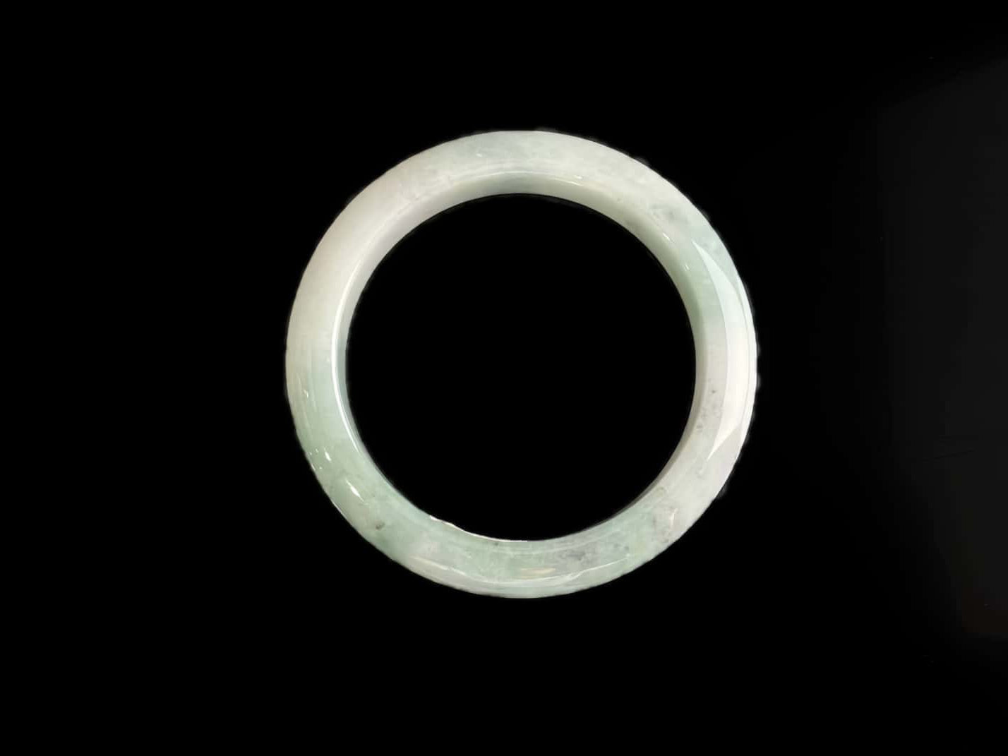 A milky white with faint green jadeite bangle.