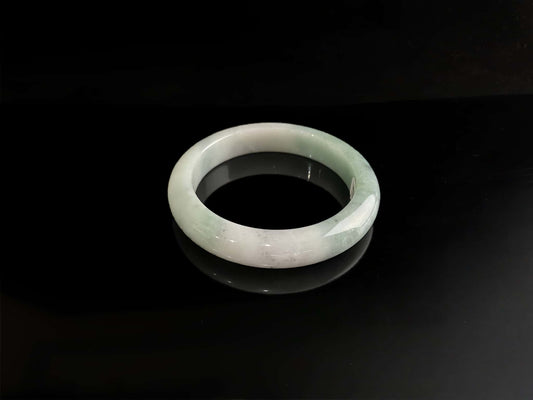 A milky white with faint green jadeite bangle.