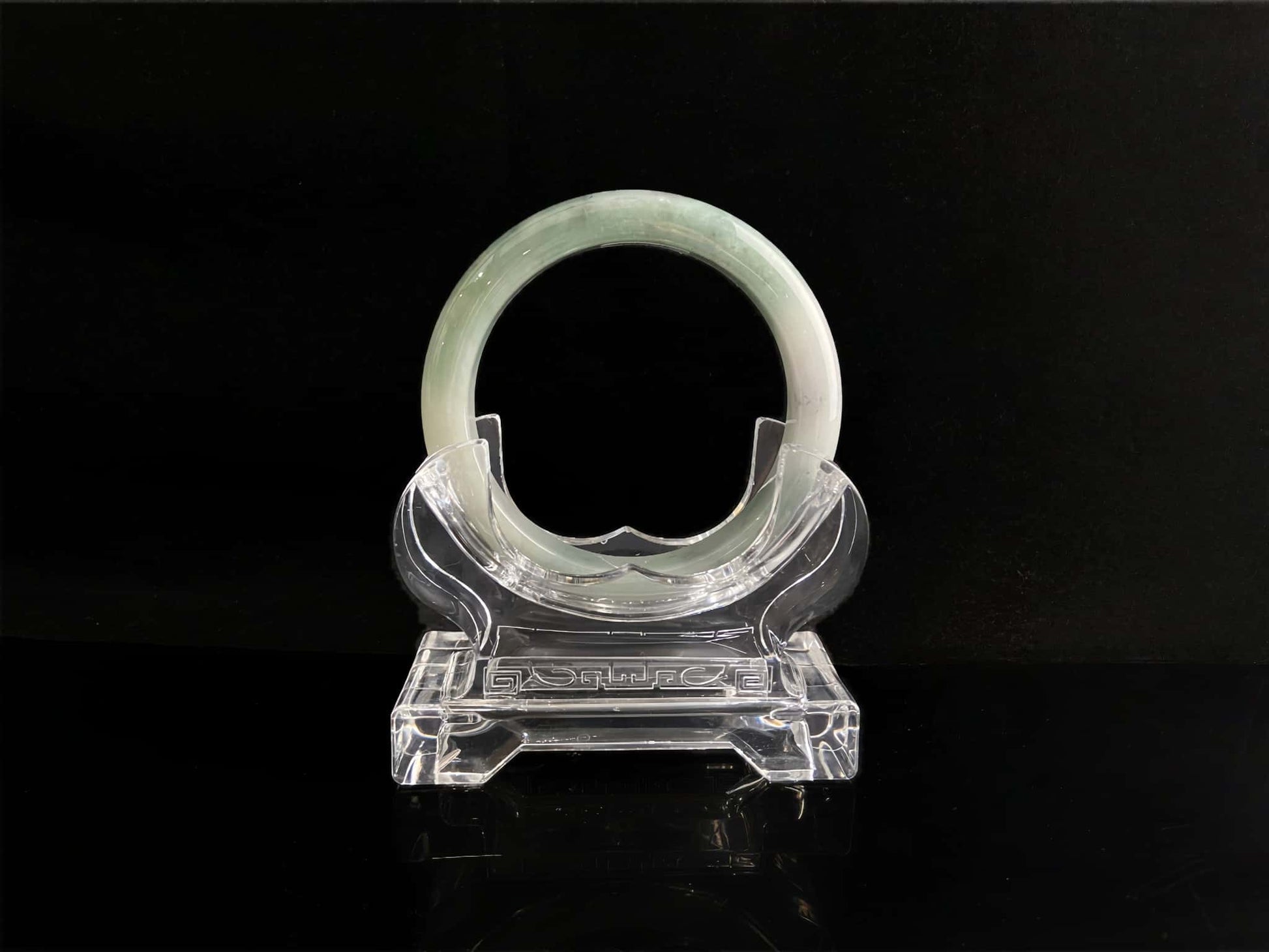 A milky white with faint green jadeite bangle.