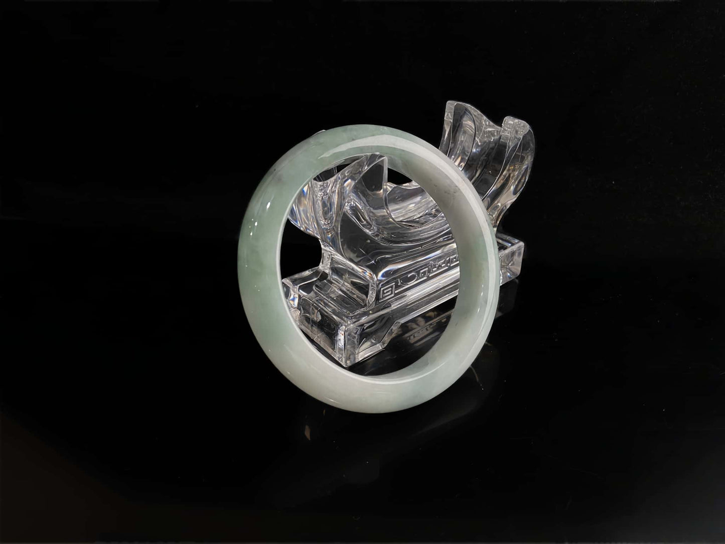 A milky white with faint green jadeite bangle.