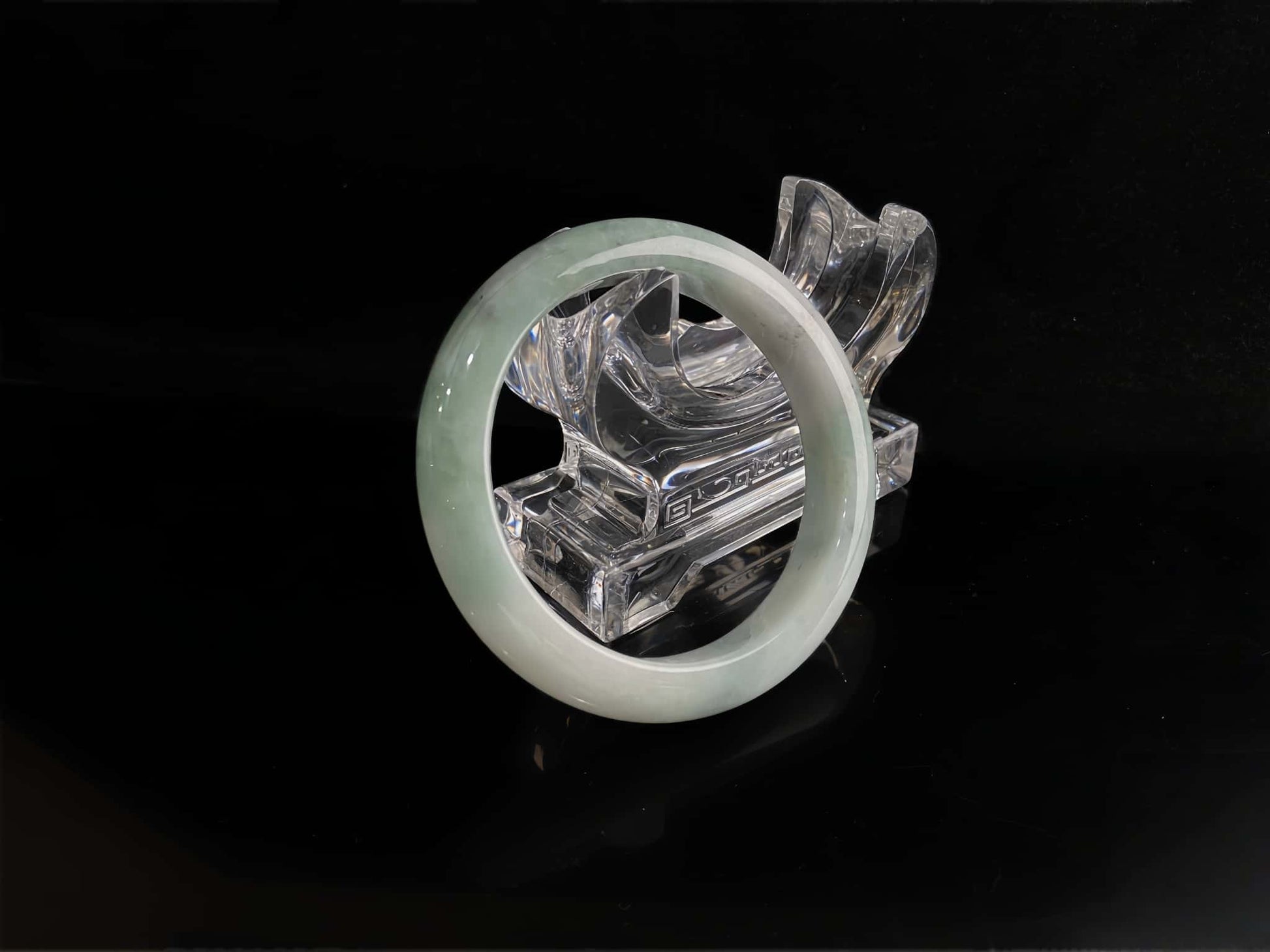 A milky white with faint green jadeite bangle.