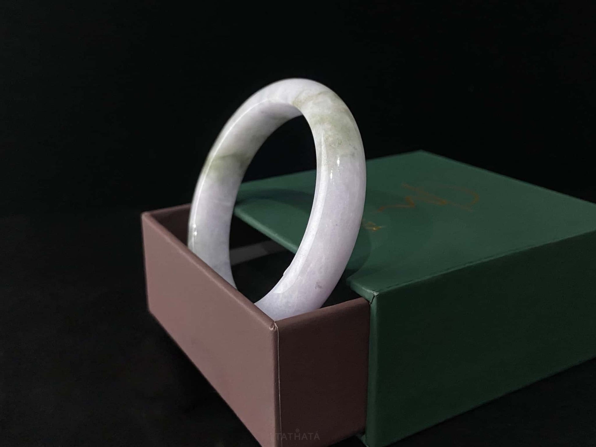 A violet cloud sprout jadeite bangle.