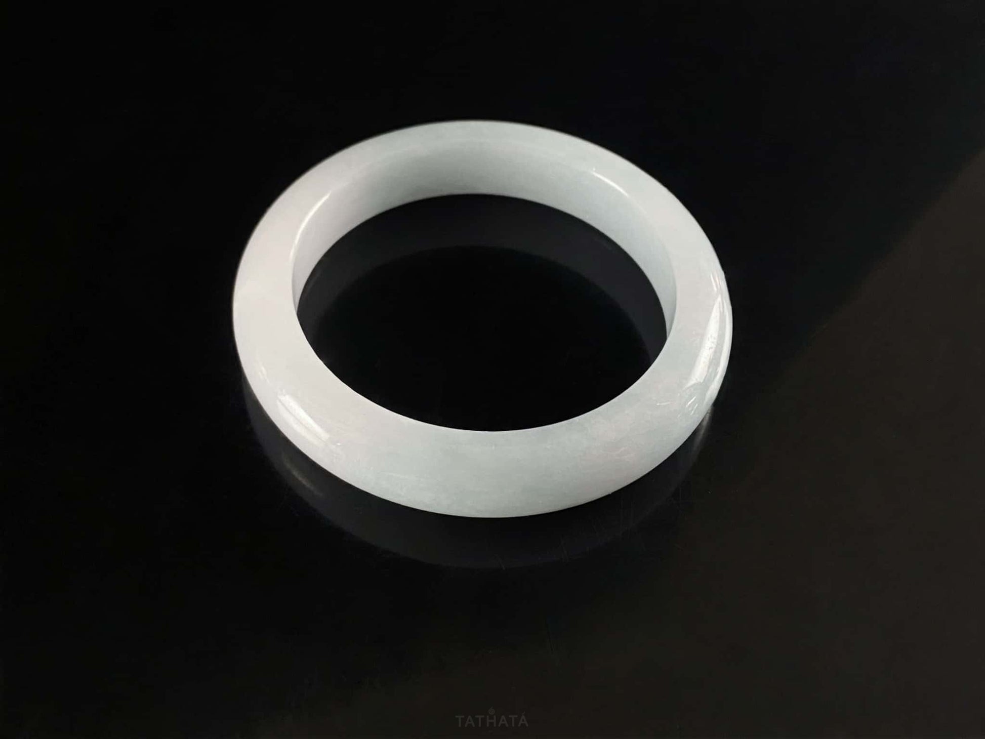 A sky blue mist jadeite bangle.