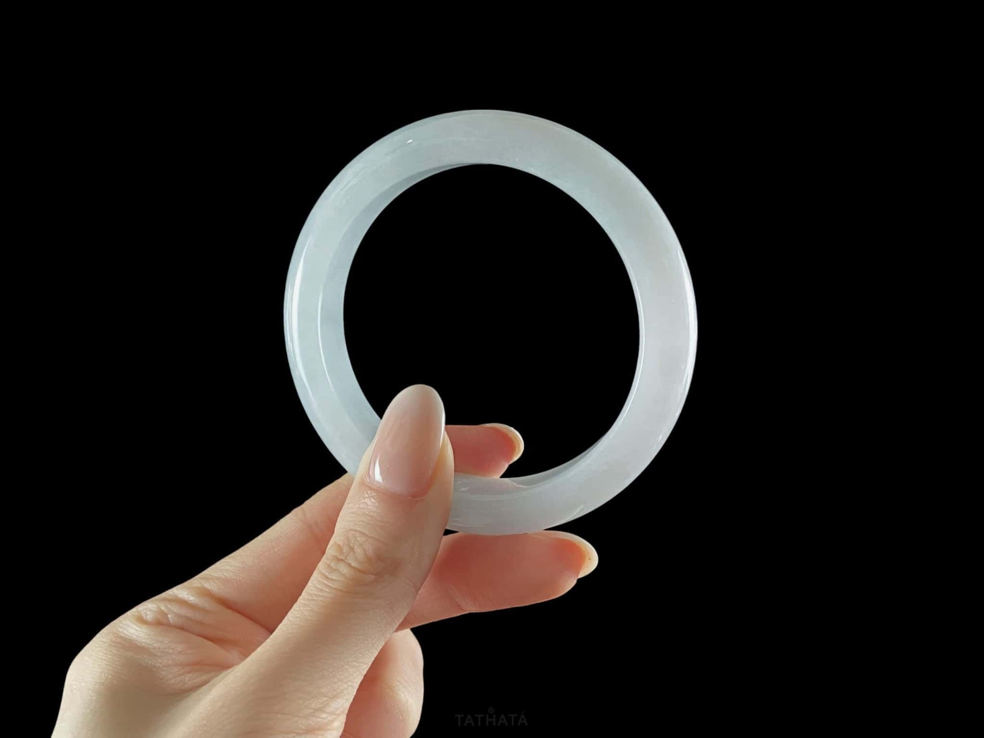 A sky blue mist jadeite bangle.