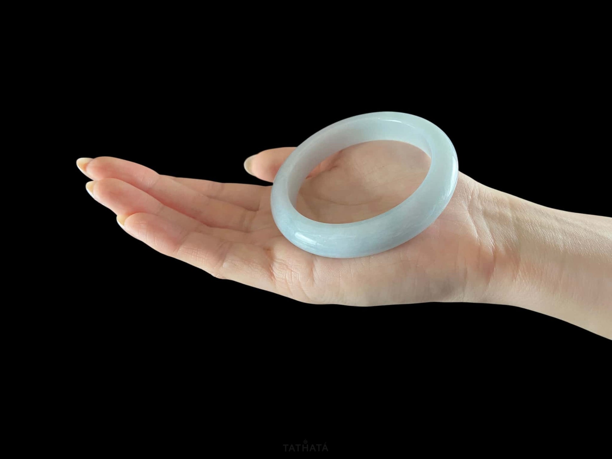 A sky blue mist jadeite bangle.