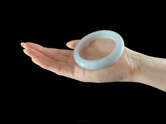 A sky blue mist jadeite bangle.