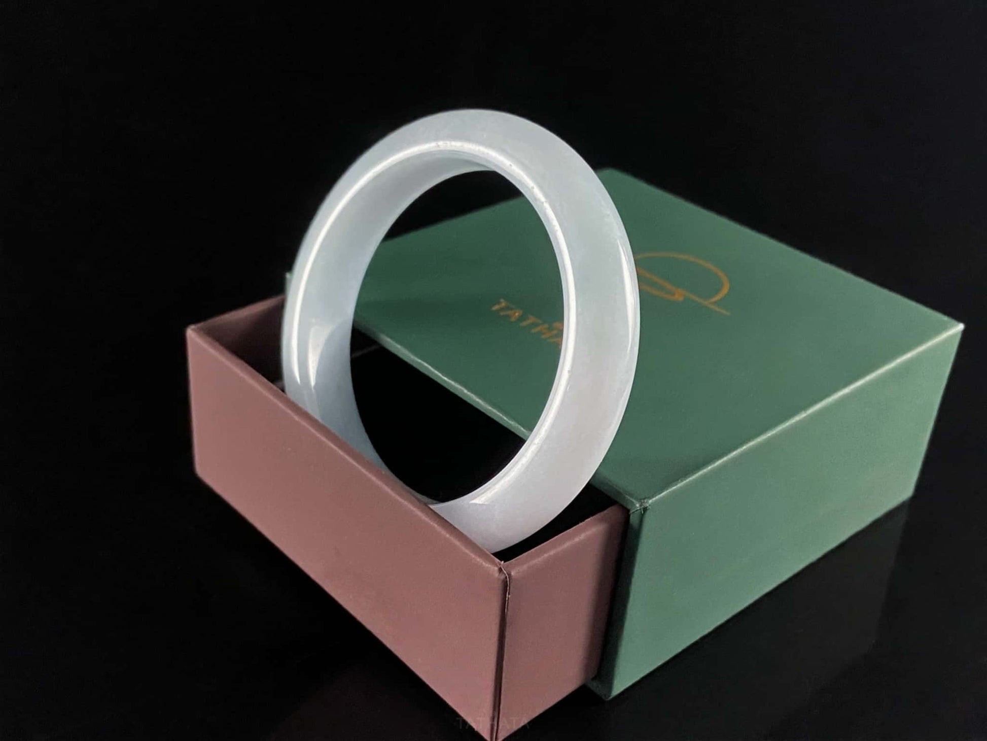 A sky blue mist jadeite bangle.